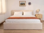Čalúnená posteľ s úložným priestorom 160×200 cm Tilo Velvet – Béžová
